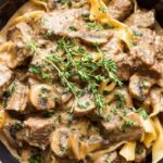 Slow Cooker Beef Stroganoff served on a rustic wooden table