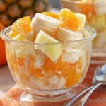 Sunshine Salad with fruits and vegetables in a glass bowl