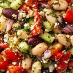 Mediterranean White Bean Salad in rustic bowl with fresh vegetables