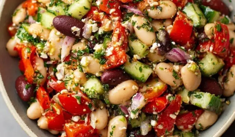 Mediterranean White Bean Salad in rustic bowl with fresh vegetables