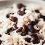 Rice and Black Beans served in a bowl with cilantro and lime