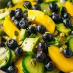 Mango Cucumber Salad with Blueberries and Avocado in a serving bowl