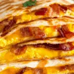 Bacon Egg and Cheese Breakfast Quesadillas served hot with sauces