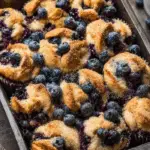 Blueberry Protein Muffins on rustic table