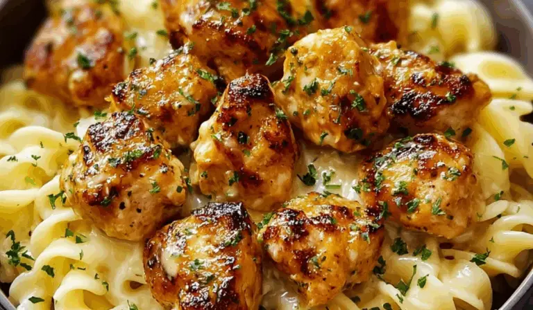 Garlic Butter Chicken Bites with Creamy Parmesan Pasta in white bowl