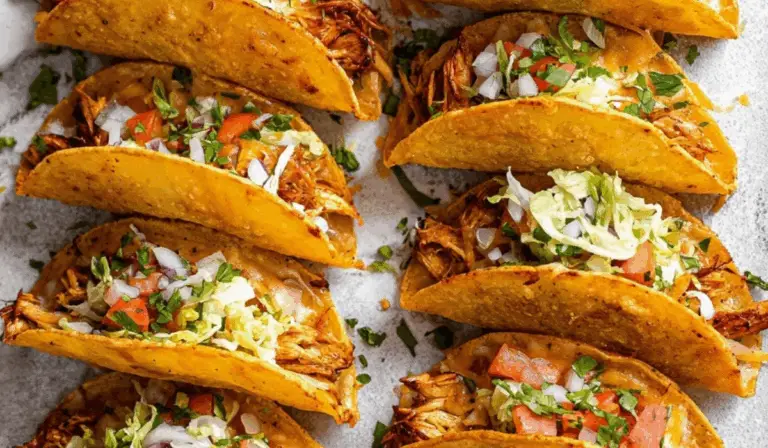 Mini Baked Chicken Tacos served on a rustic wooden tray