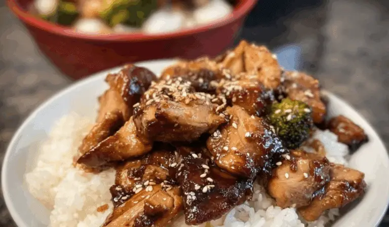 Crock Pot Teriyaki Chicken served on rice with sesame seeds