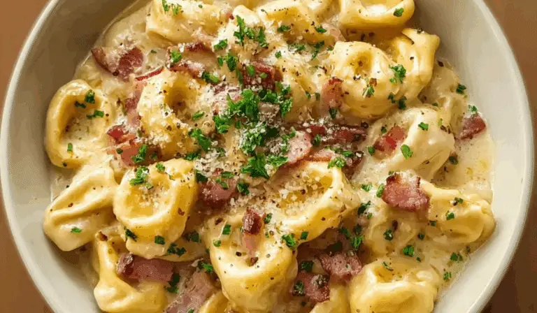 Creamy Tortellini Carbonara served hot with bacon and Parmesan