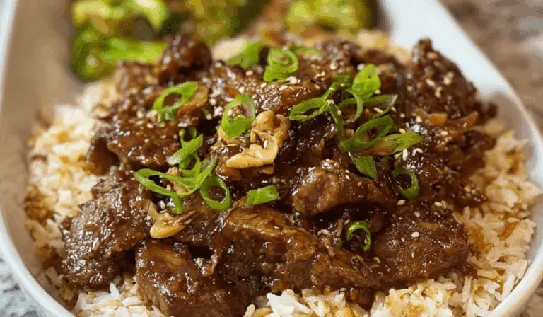 Slow Cooker Mongolian Beef served with rice and garnish
