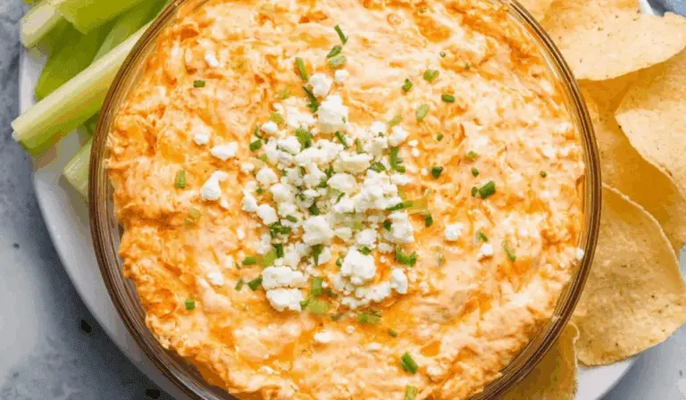 Greek Yogurt Buffalo Chicken Dip served with tortilla chips and celery