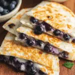 Blueberry Breakfast Quesadilla on rustic breakfast table