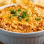Smoked Buffalo Chicken Dip in cast iron with melted cheese