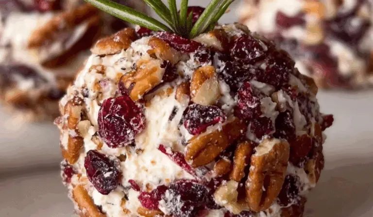Cranberry Pecan Goat Cheese Ball holiday appetizer on wooden board