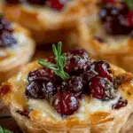 Savory Cranberry and Brie Tartlets on holiday platter