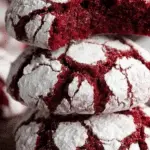 Fudgy Red Velvet Crinkle Cookies stacked on holiday table