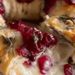 Brie cheese and cranberry Christmas wreath on rustic table