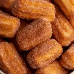 Baked Churro Bites on a rustic plate