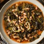 Black Eyed Pea Soup With Collard Greens in rustic setting