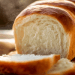 Freshly baked white bread from scratch on a wooden board