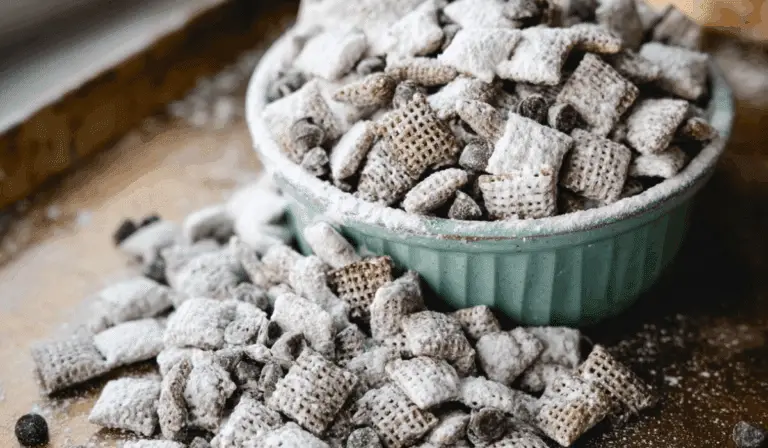 Homemade Muddy Buddies Chex Mix in a rustic bowl