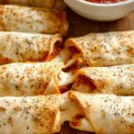 Pizza Roll Ups served hot with marinara dip