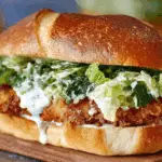 Crispy Chicken Caesar Sandwich on brioche bun with Caesar dressing