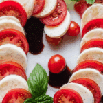 Candy Cane Caprese Board on marble with festive lights
