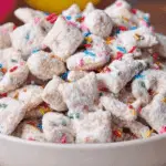 Birthday Cake Puppy Chow in a festive bowl