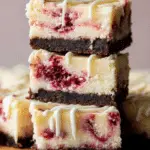 White Chocolate Raspberry Cheesecake Bars on tray