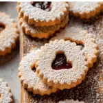 Linzer Cookies on rustic wooden tray