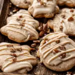Pecan Sugar Cookies with Brown Butter Icing on a wooden tray