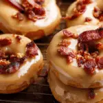 homemade maple bacon doughnuts stacked with glaze