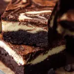 Mocha Cheesecake Brownies on rustic table